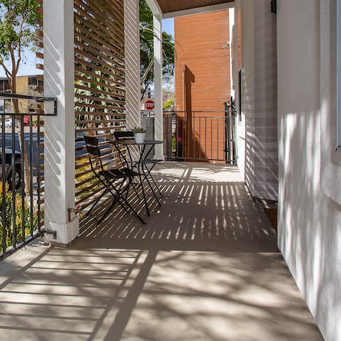 Bask in the dappled sun out on the balcony with your morning coffee