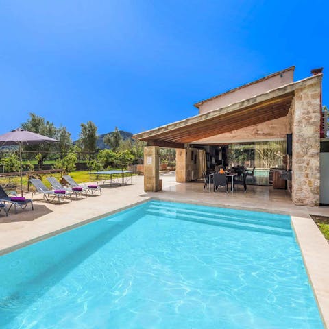 Find some respite from the midday heat in the shimmering swimming pool