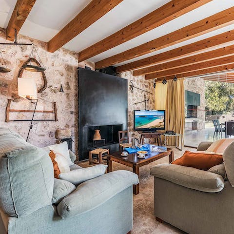 Embrace the old farmhouse vibes in the wood-beamed living room