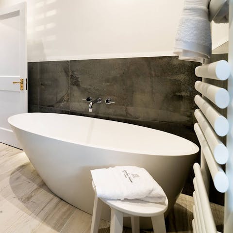 Sink into your deep, freestanding tub after a day of exploring, enjoying a nice glass of wine