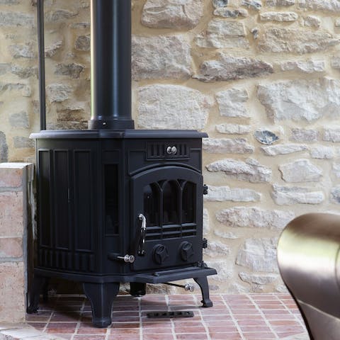 Spend a cosy evening by the wood-burning stove 