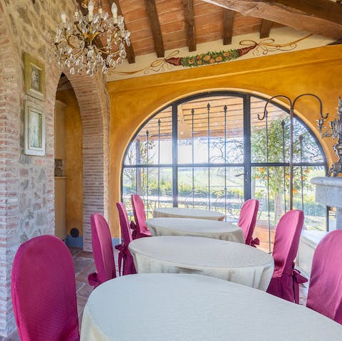Dine indoors in the light of the big, arched window