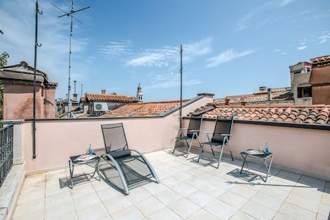 Laze around in the sunshine on the rooftop terrace