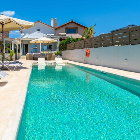 Swim laps in the private swimming pool
