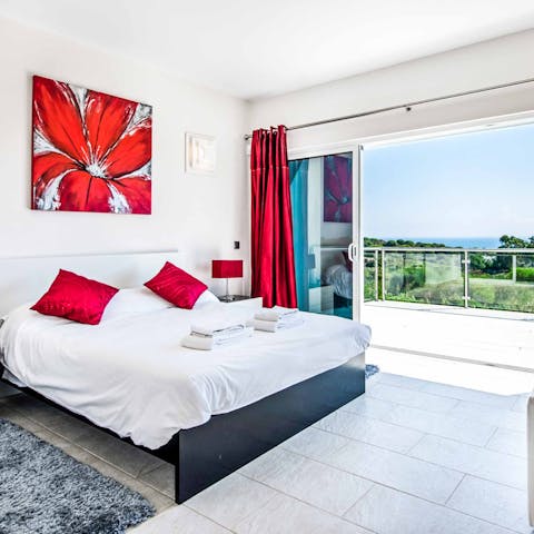 Unwind while taking in the scenic view from the bedroom