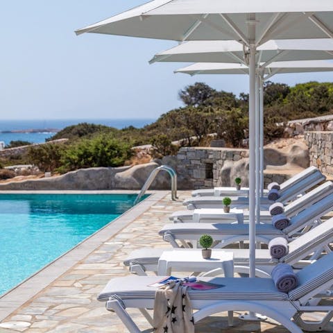Drink in the sea views from the comfort of the poolside loungers