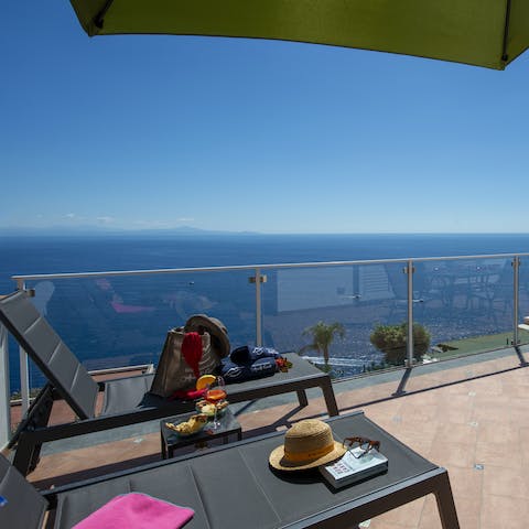 Take in majestic blue vistas over the Mediterranean Sea from the loungers 