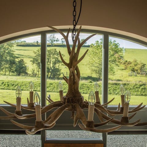 Gaze up at the deer antler chandelier – it's a unique focal point of the home 