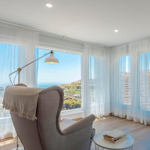 Gaze out at breathtaking views from the comfort of the bedroom's arm chair