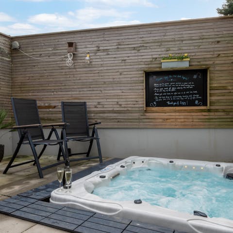 Toast the day with sundowners in the hot tub