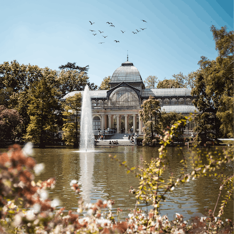 Get some fresh air at Parque del Retiro, a twelve-minute walk away