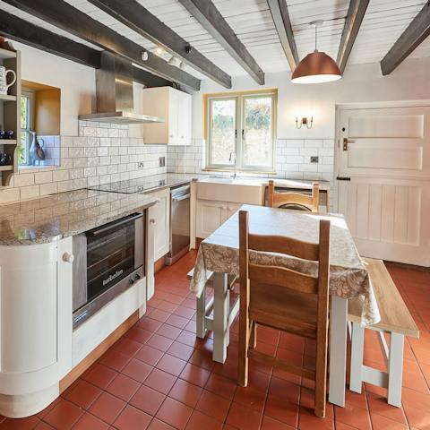 Rustle up a feast beneath wooden beams in the traditional kitchen
