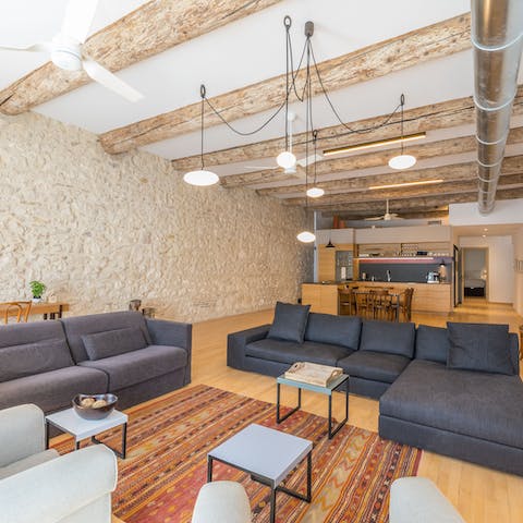 Kick back and relax on the massive L-shaped sofa in the open plan living area