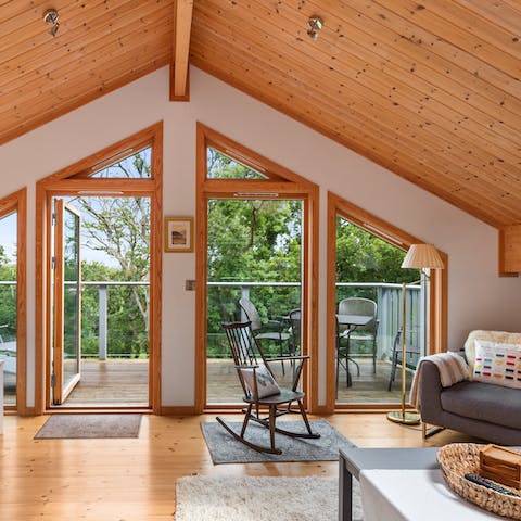 Throw open the glass doors and let the sea air into the upstairs living room