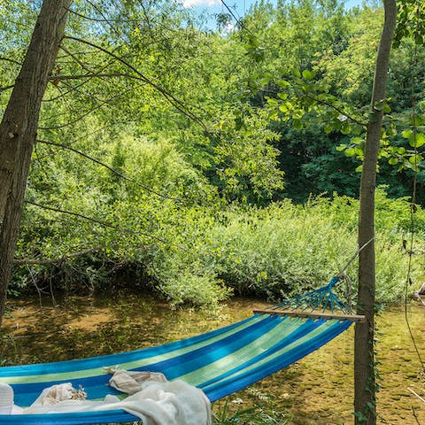 Swing in the hammock by the rippling river