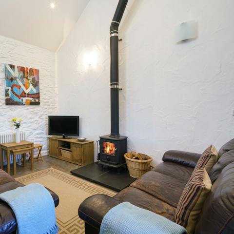 Cosy up in front of the wood burner after a day on Newport beach