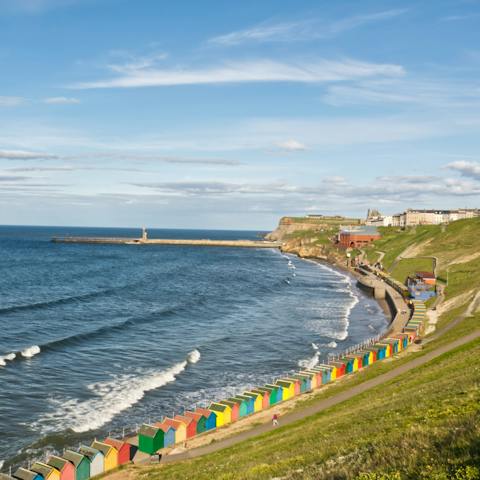 Sink your toes in the sand at Whitby Beach, a five-minute stroll from your door