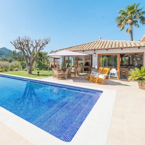 Take a dip in your saltwater pool to cool down from the midday sun