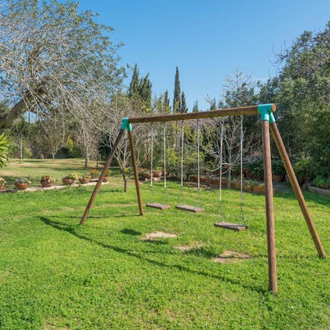 Let the kids enjoy the garden and swing set while you catch some rays
