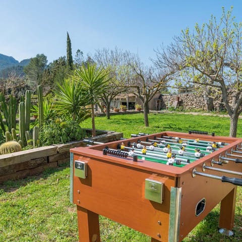 Challenge the family to a game of table football on the lawn