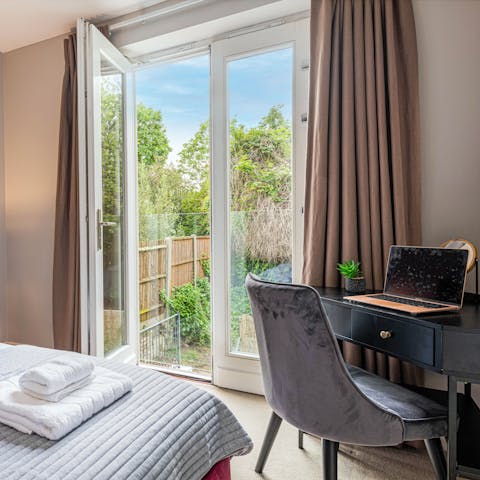 Get some work done at the remote desk, with garden views from the Juliet balcony