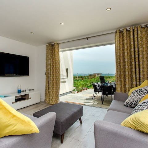 Throw open the glass doors and let the sea breeze refresh the living room