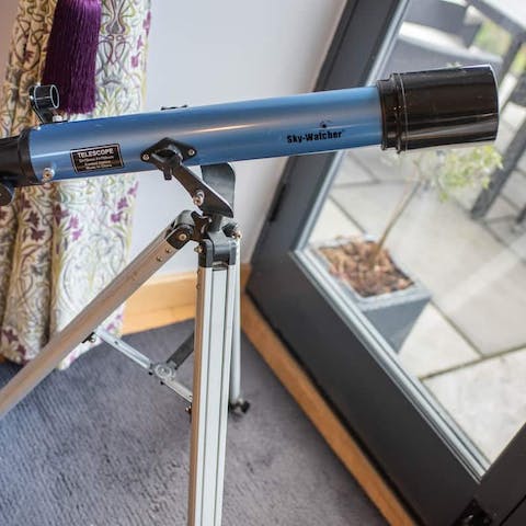 Gaze out at the night skies through the telescope