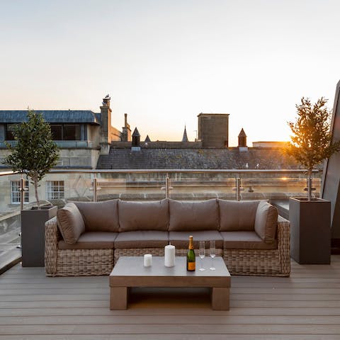 Relax with a glass of bubbly on the private roof terrace 