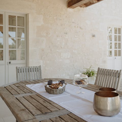 Gather around  the alfresco dining table to share stories of adventure