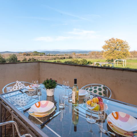 Dine alfresco on Italian dishes while admiring the rolling views