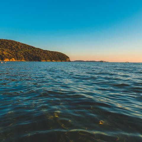 Drive 10km to Cala Violina and dip your toes in the sea