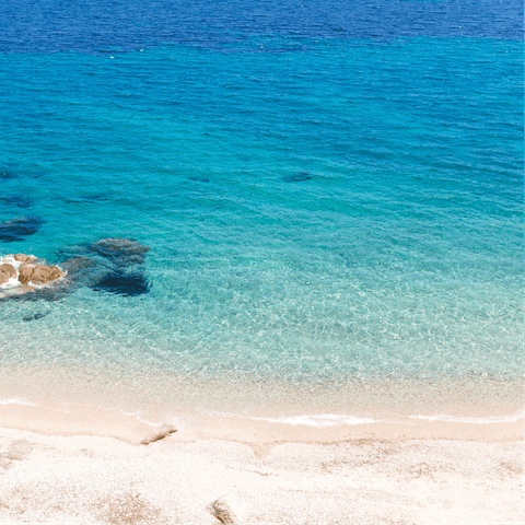 Head over to Agios Stefanos Beach for a day in the sun, just a ten-minute drive from home
