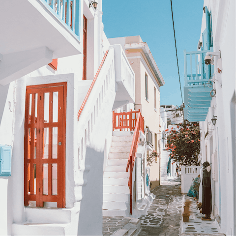 Take a leisurely stroll through the streets of Mykonos Town, just a five-minute walk from home