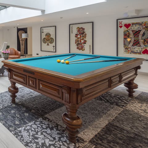 Challenge your friends to a game of pool in the communal games area