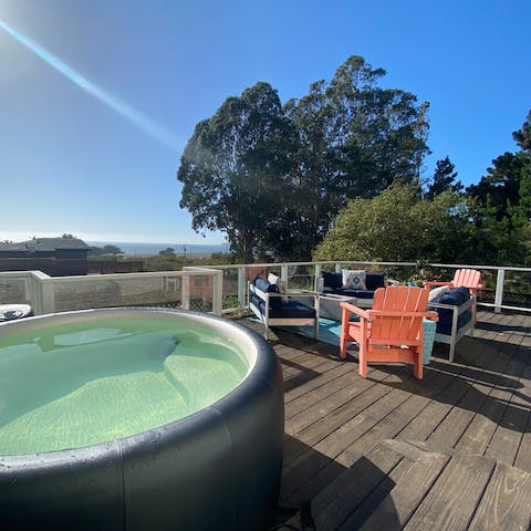 Sip bubbly from the hot tub while gazing at sea views