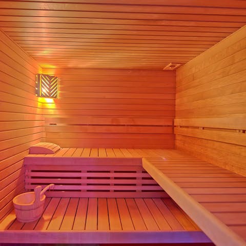 Let the steam relax your muscles in the private Finnish sauna