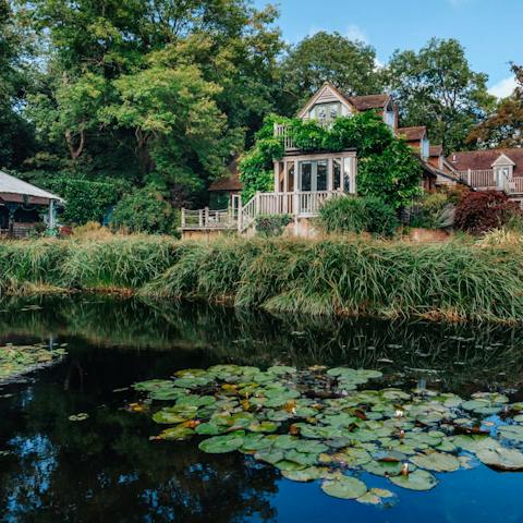 Explore the twenty-two acres of grounds, including a lake and woodlands