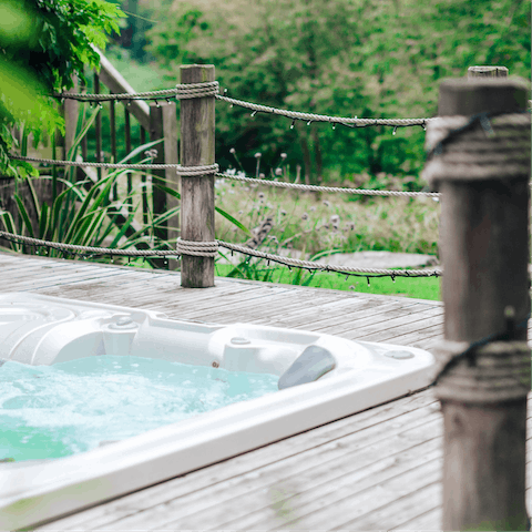 Sit back and relax in the sunken hot tub under the stars