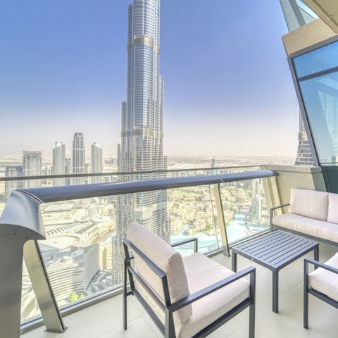 Admire the vistas of the Burj Khalifa from the private balcony