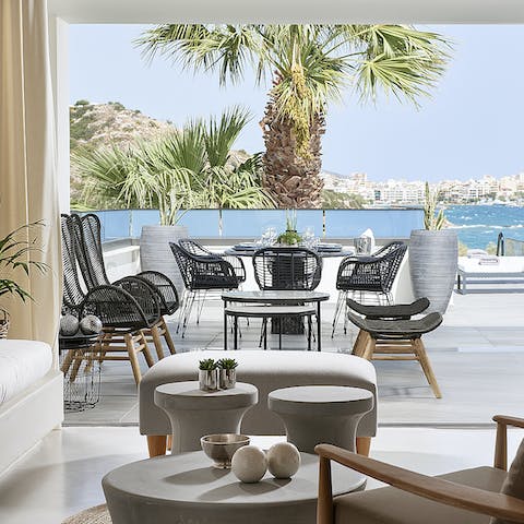Enjoy alfresco meals on the terrace as the palm trees sway around you