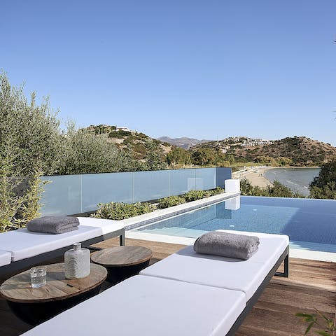 Lounge by the pool while admiring mountain views