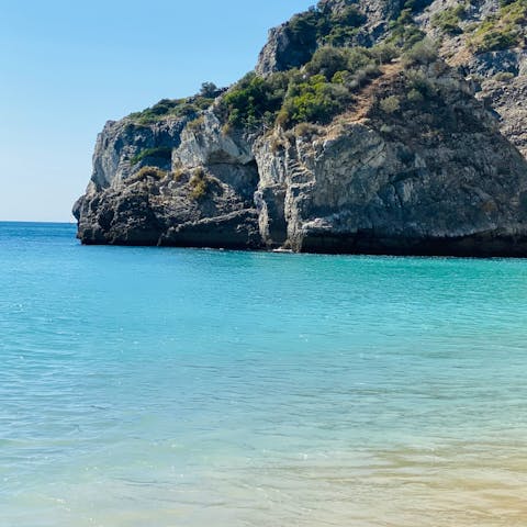 Drive to a beach in Sesimbra for a dip in the sea