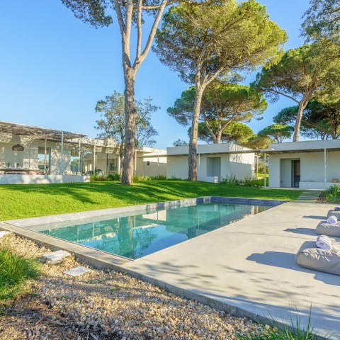 Cool off in the private swimming pool in the large gardens