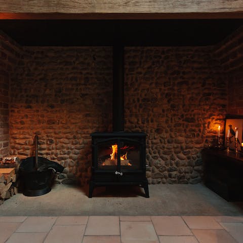 Curl up by the wood-burning fire with a glass of wine