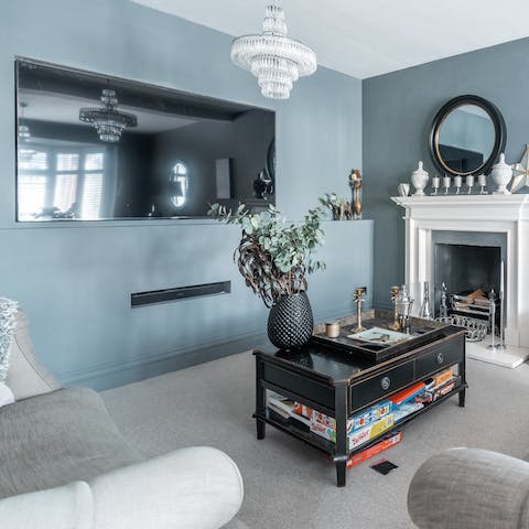 Cosy up for a Netflix movie or a family game night in the blue-hued lounge