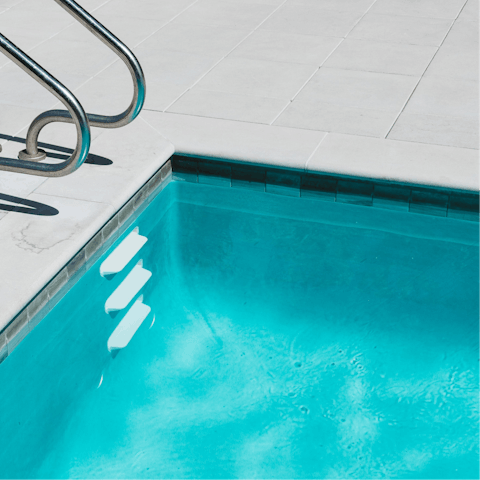 Take a refreshing dip in one of the shared swimming pools 