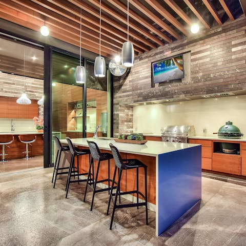 Treat guests to a smoky feast fresh from the barbecue grill in the outdoor kitchen