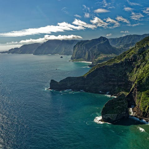 Discover Madeira's lush landscape, spectacular hiking trails, old traditional villages, and unspoiled beaches