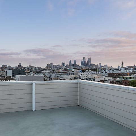 Watch the sun set over the city from your communal roof terrace