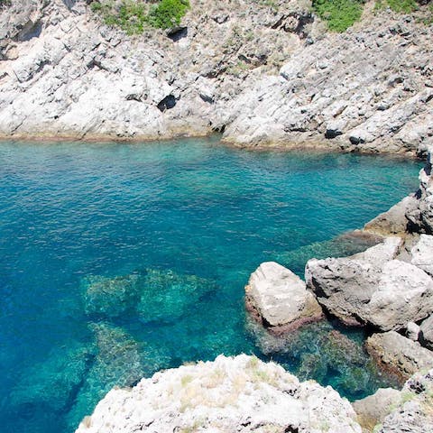 Descend the cliffside steps to reach the crystal clear Tyrrhenian Sea